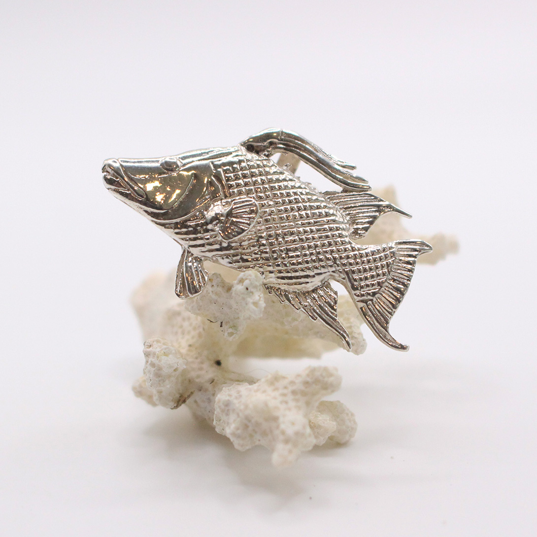 A picture of a sterling silver hogfish pendant.