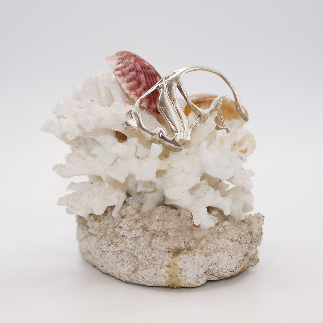 A sterling silver angel fish pendant.