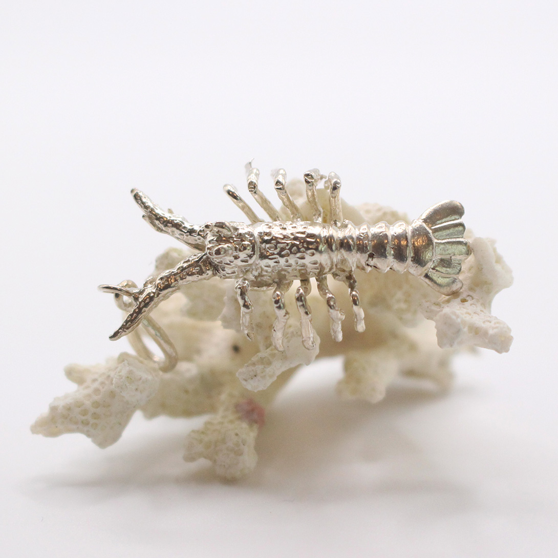 A picture of a sterling silver lobster pendant.